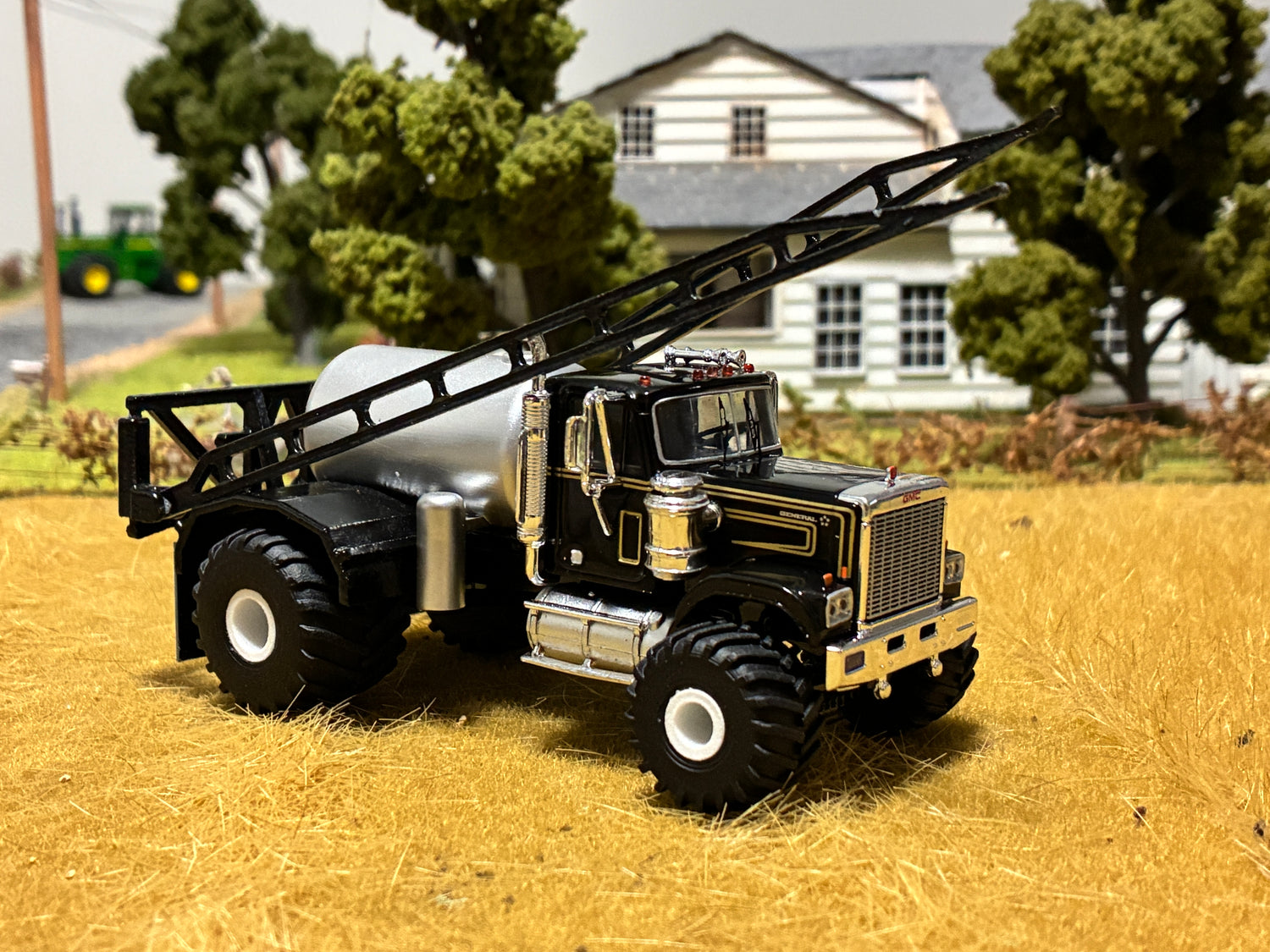 Model truck on a reflective surface with a blurred background